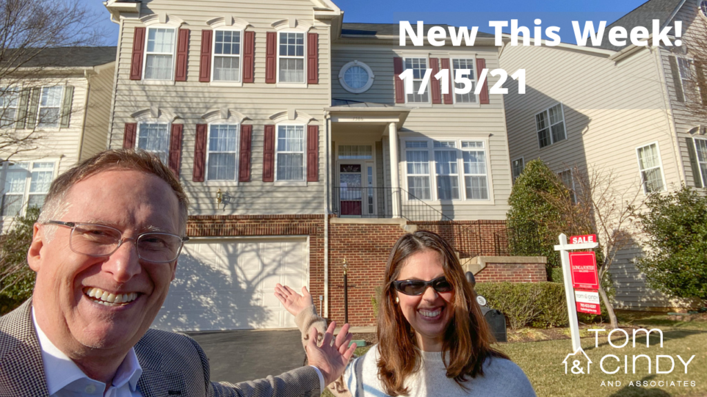 Happy People in front of a House